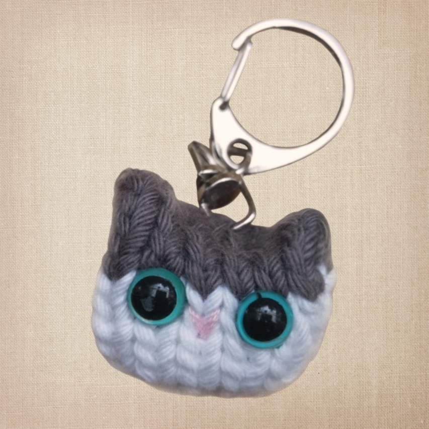 Knitted Cat Keychain of a gray and white cat
